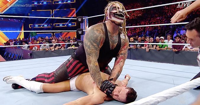 Balor succumbs to the Mandible Claw but it wasn't enough to keep him down after the bell
